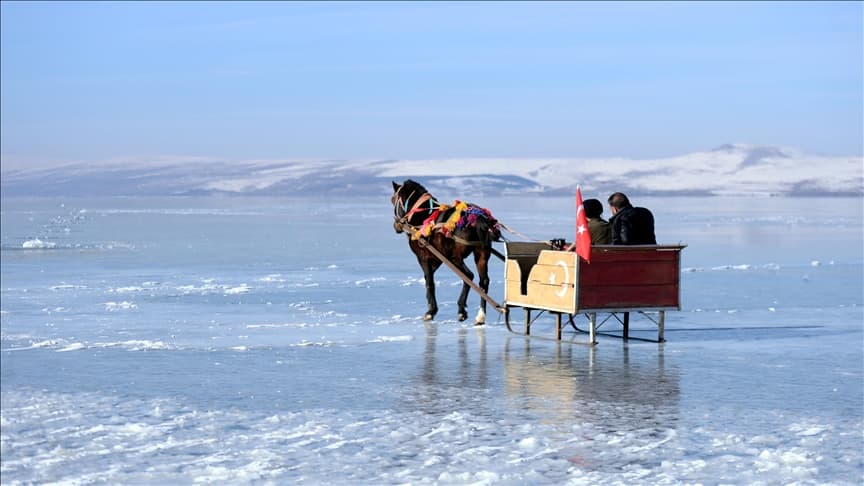 lake cildir frozen surface and horse sleigh