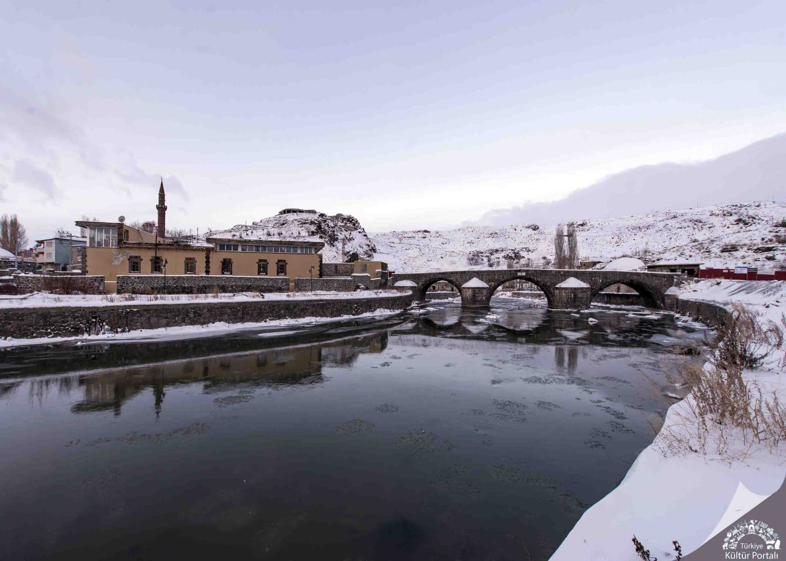 historical stone bridge kars stream and mosques